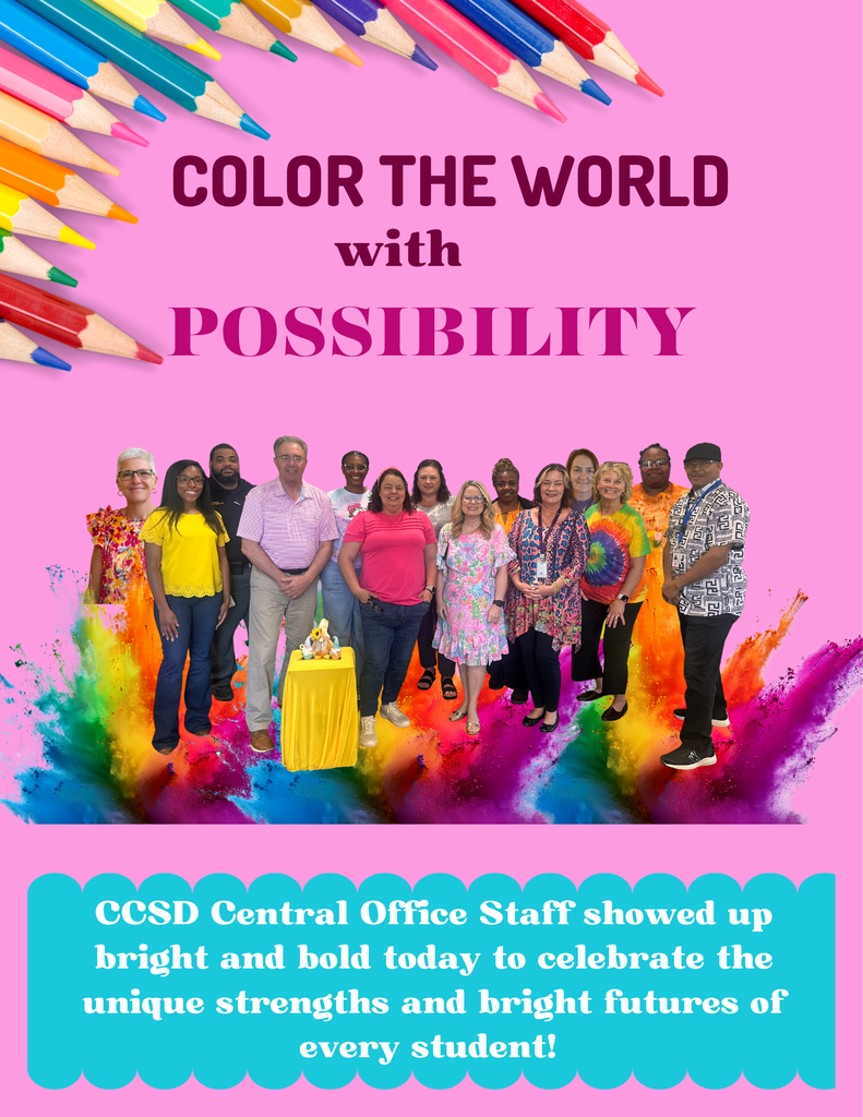 14  staff members standing with bright colors on