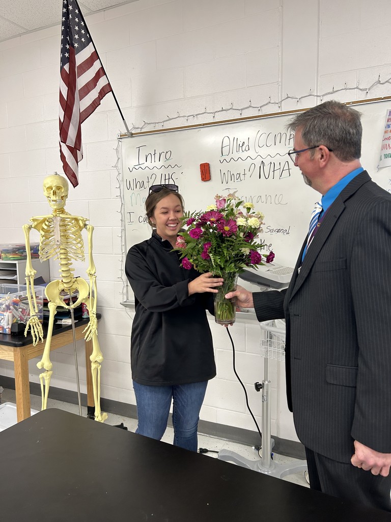 hannah moncrief receiving flowers for high school teacher of the year