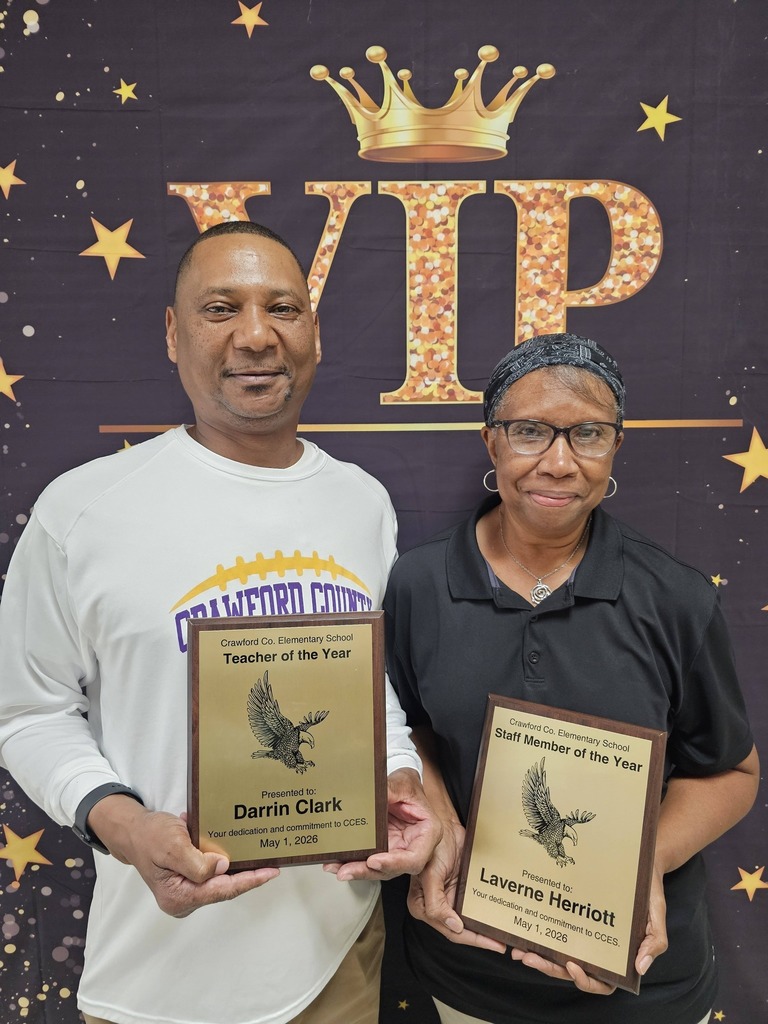 Teacher and Support Staff of the Year Standing with Plaque 