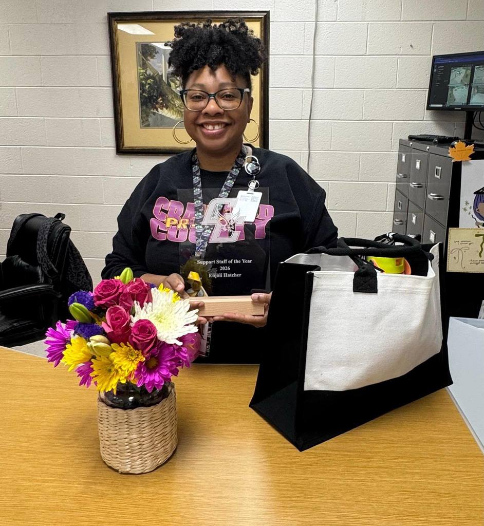  Support Staff Standing at Desk with Prizes