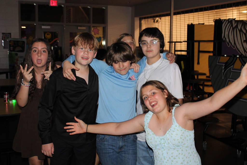 students pose for camera at spring dance