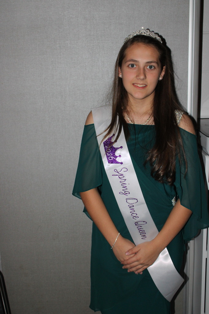 spring dance queen poses for camera