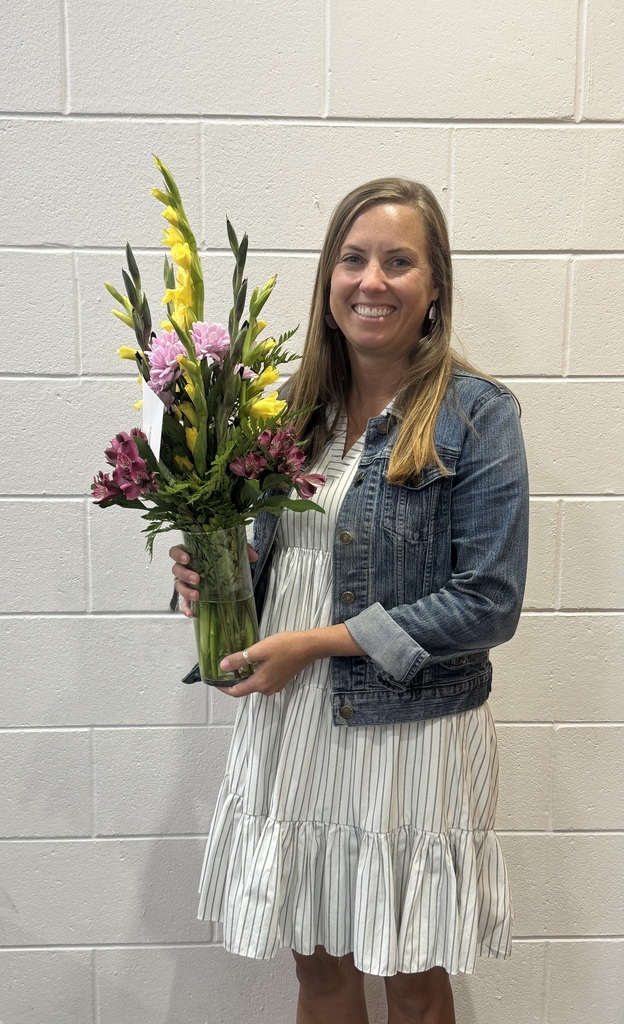 laurnen johnson holding a vase of flowers