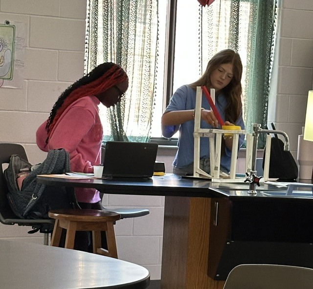 two students working on the group project