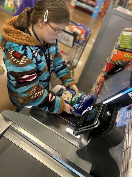 student practices scanning at Kroger