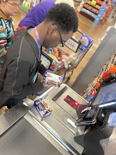 student practices scanning at Kroger