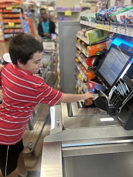 student practices scanning at Kroger