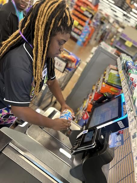 student practices scanning at Kroger