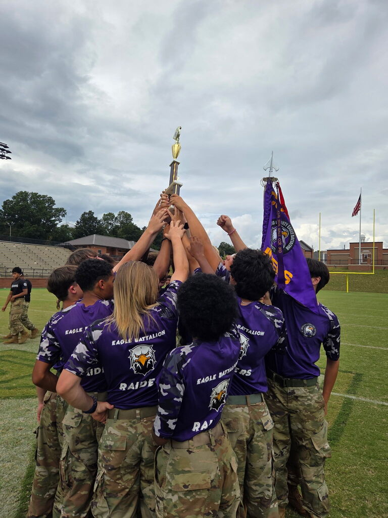 raiders holding trophy