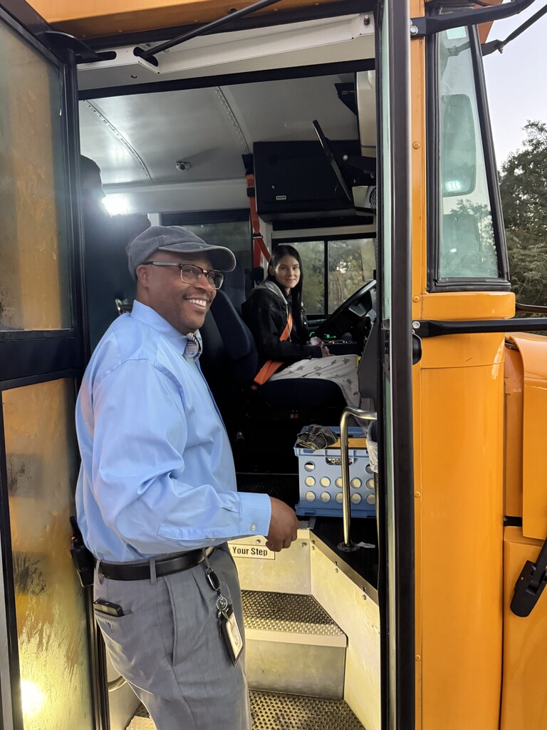 Mr Lanier greeting a bus driver