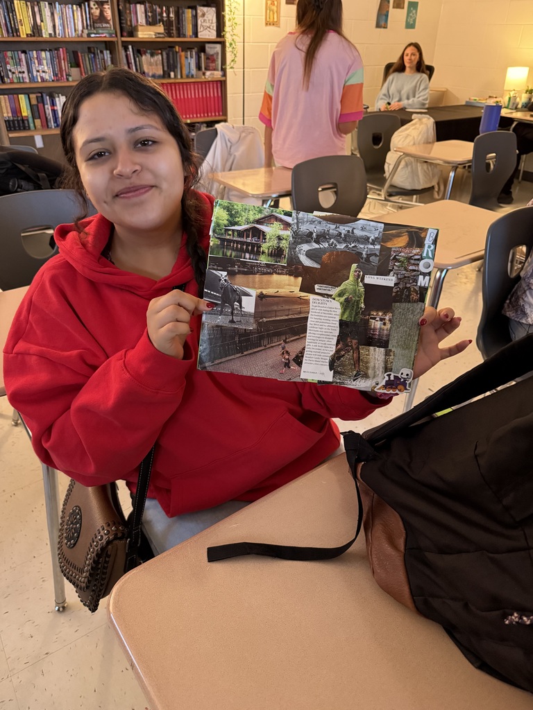 student holding up her collage