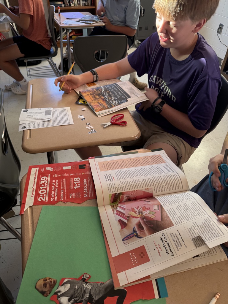 student working on his collage