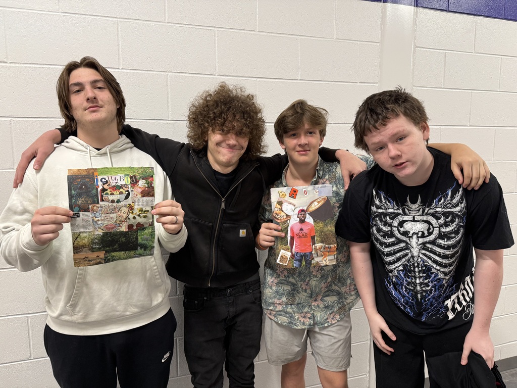 students holding up their collages