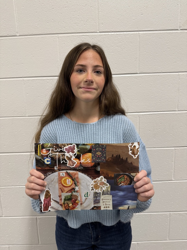 student holding up her collage