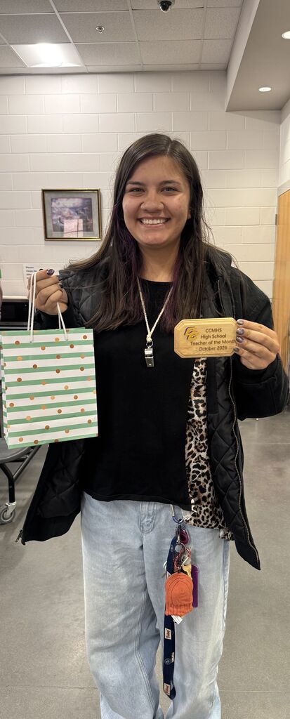 Ms. Gonzalez posing with her award