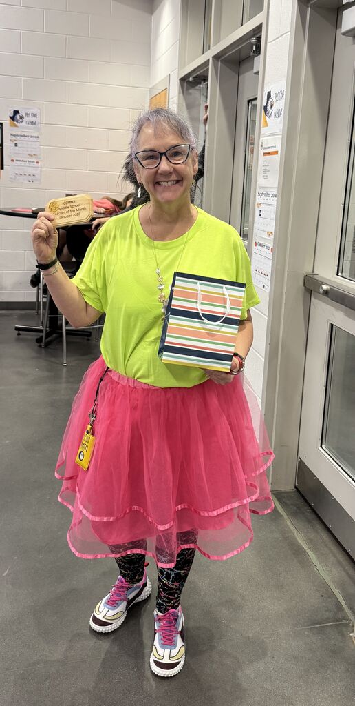 Ms. Keys posing with her award