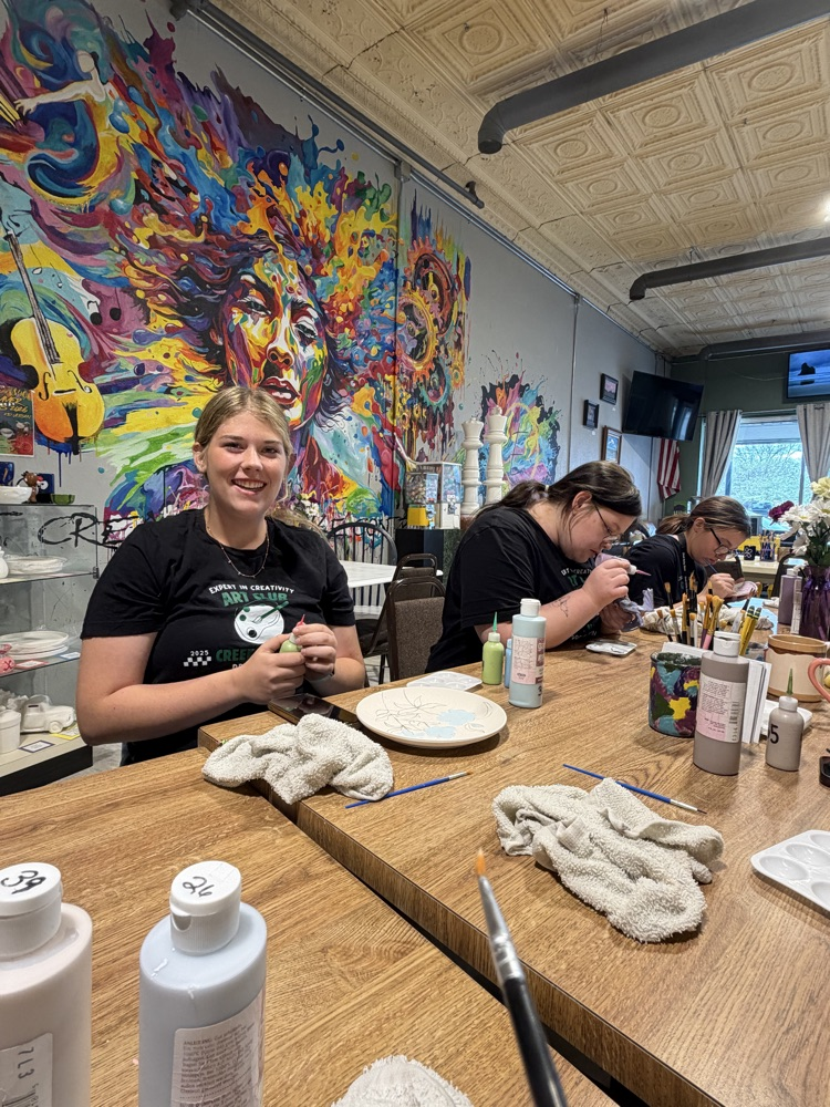 students working on pottery 