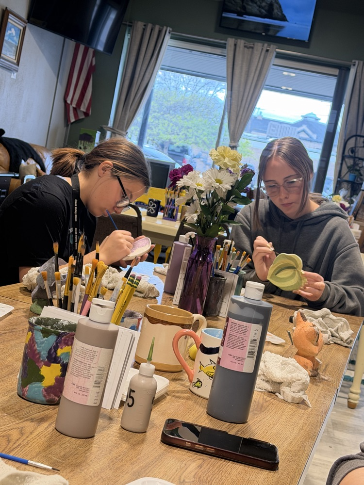 students working on pottery 