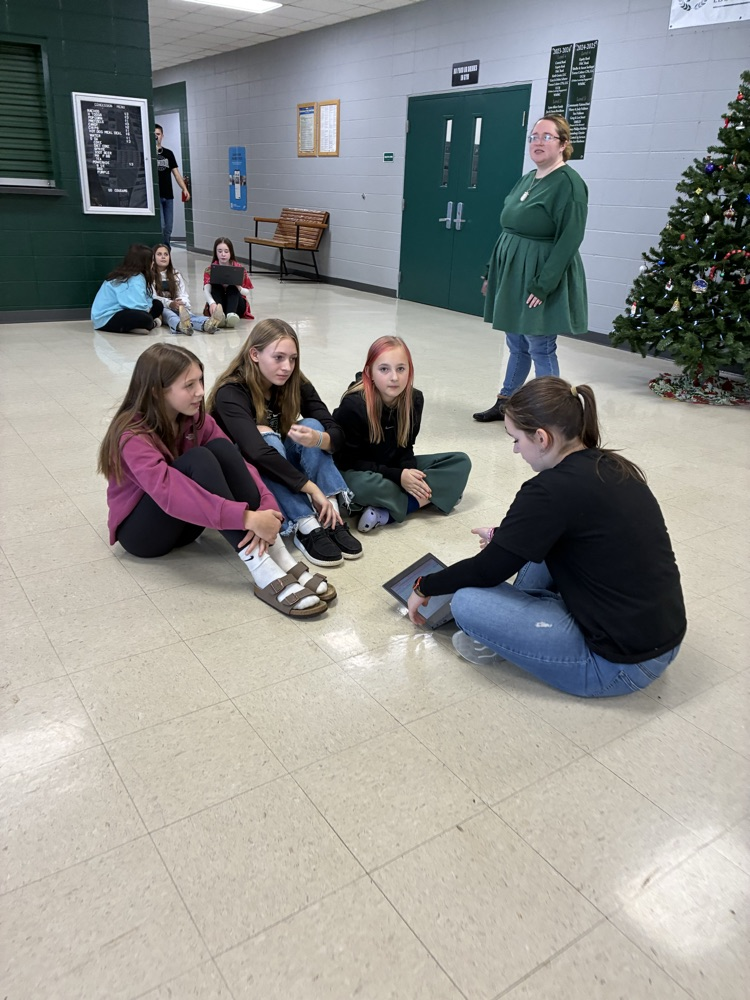 Students being read to.