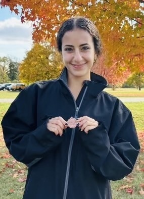 Sarah Wazne pictured here with her All Regional Medal at this past Saturdays Race. She finished in 12th place and qualified for the State Meet