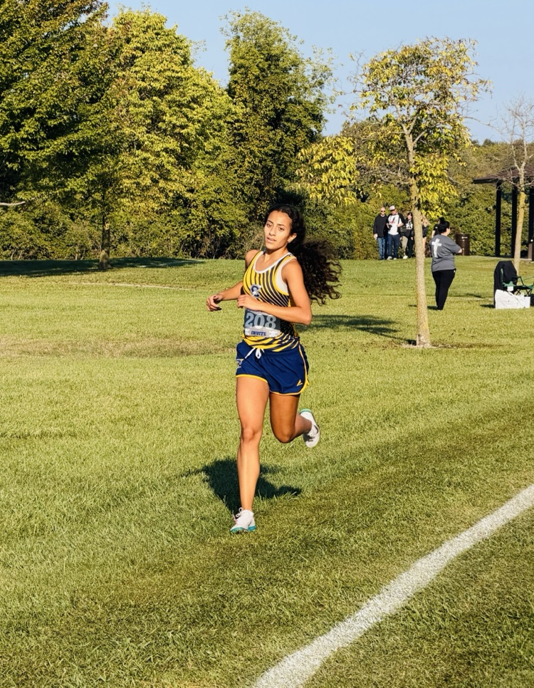 Cross Country runner Sarah Wazne running hard at a meet earlier this season