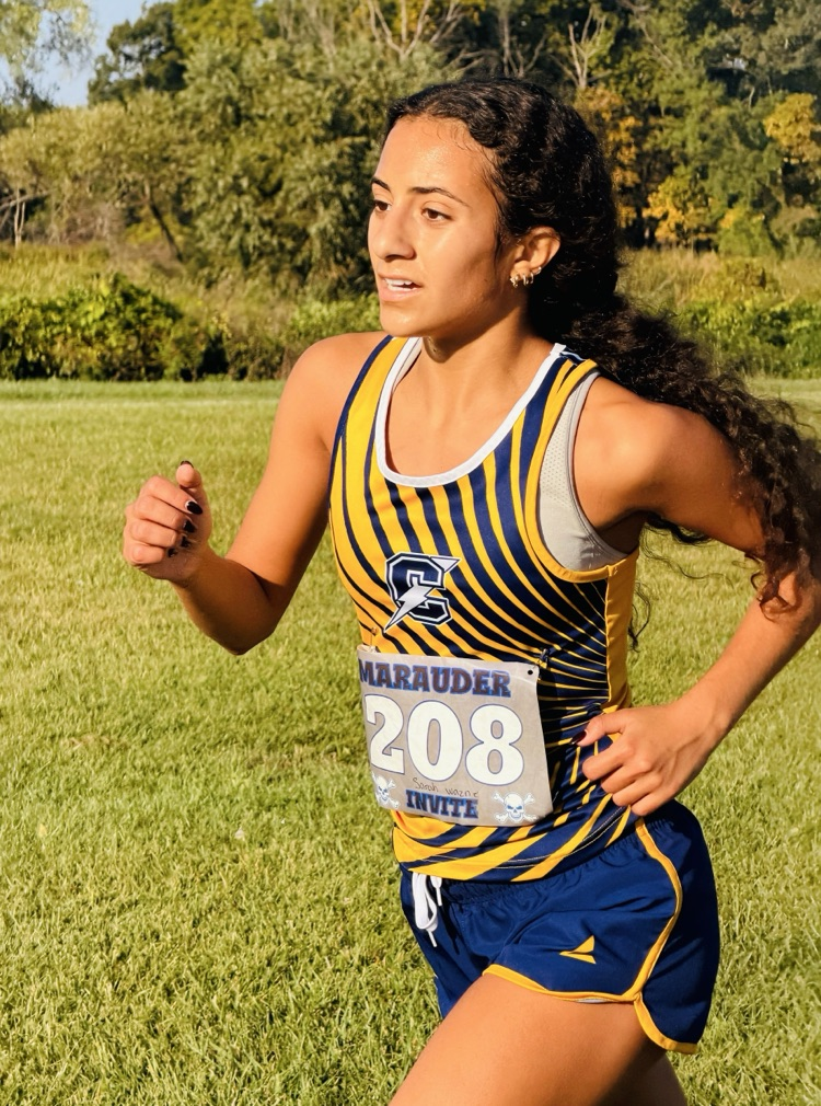 Cross Country Runner Sarah Wazne working hard to run across the finish line