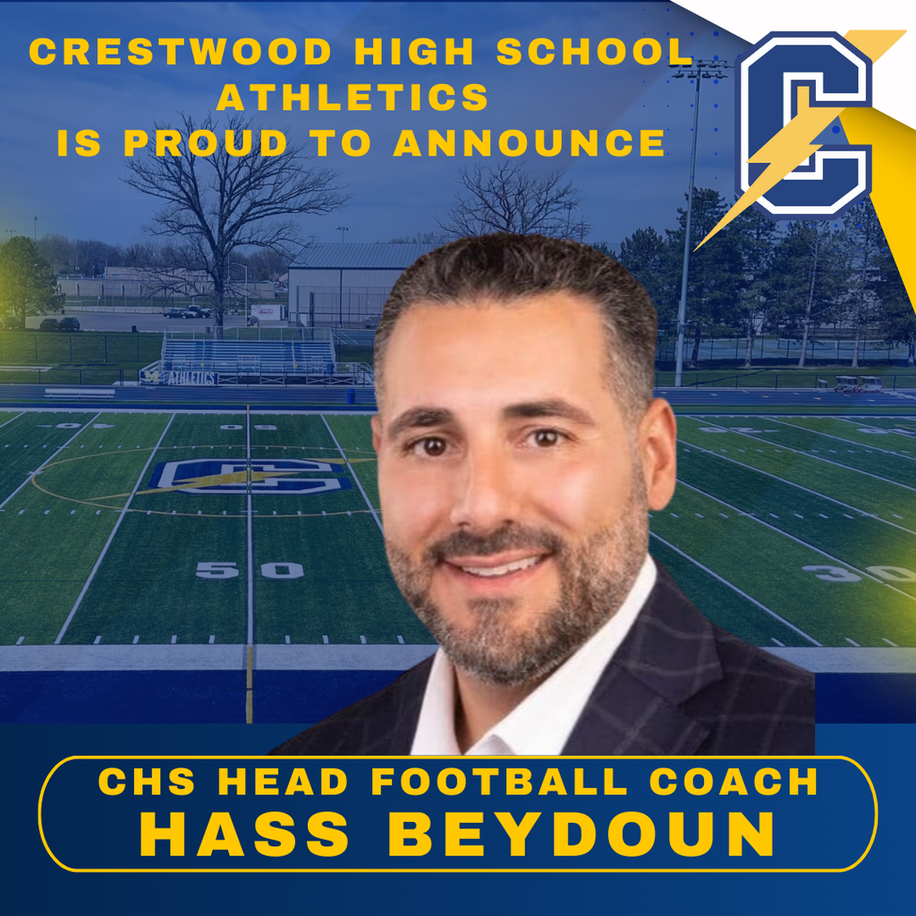 This is for informational purposes only. For medical advice or diagnosis, consult a professional. A square social media graphic announcing a new athletic appointment at Crestwood High School. The background features a blue-tinted aerial view of a green football field with a large "C" logo at midfield. In the upper left, bold yellow text reads "CRESTWOOD HIGH SCHOOL ATHLETICS IS PROUD TO ANNOUNCE," and a large blue and white "C" logo with a yellow lightning bolt sits in the top right corner. Centered in the foreground is a professional headshot of a smiling man with dark hair and a groomed beard, wearing a dark patterned blazer over a white shirt. At the bottom, a rounded blue banner with a yellow border contains the text "CHS HEAD FOOTBALL COACH HASS BEYDOUN" in bold yellow capital letters.