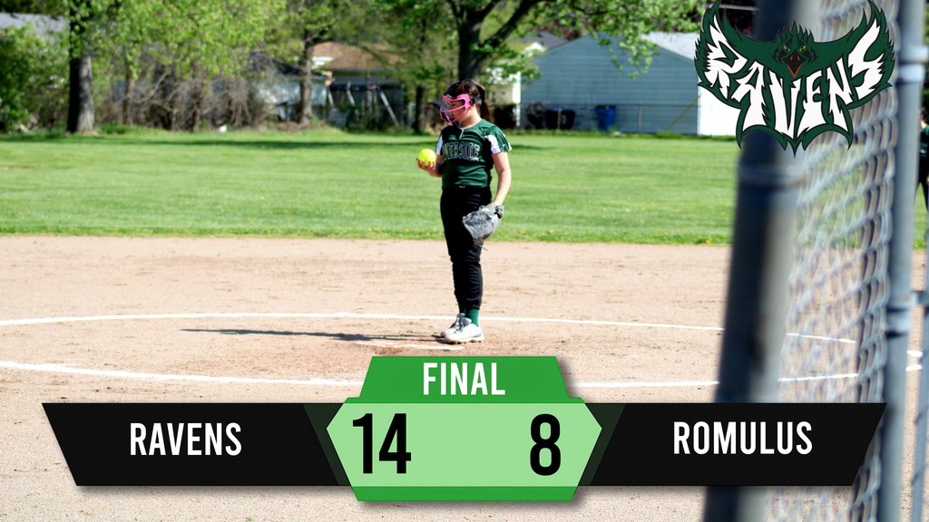 A softball player stands on a field, wearing a green uniform. The score reads 14 to 8. Trees and a fence are in the background.