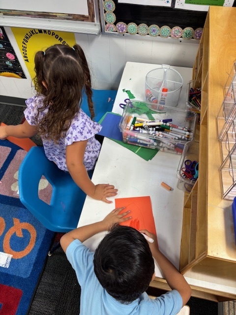 Preschoolers playing in centers
