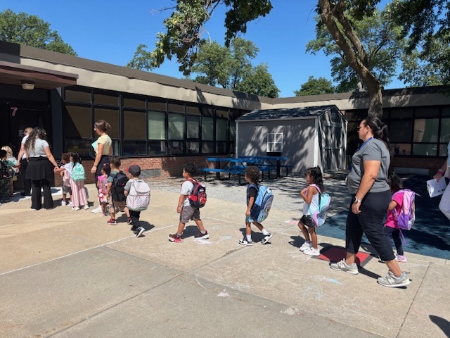 Preschool students heading inside