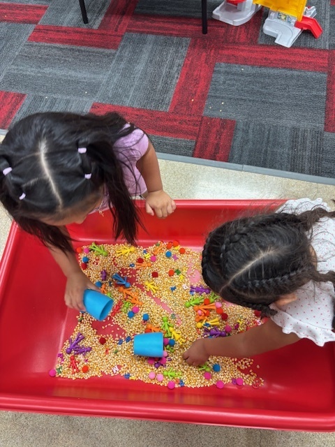 Preschoolers playing in centers