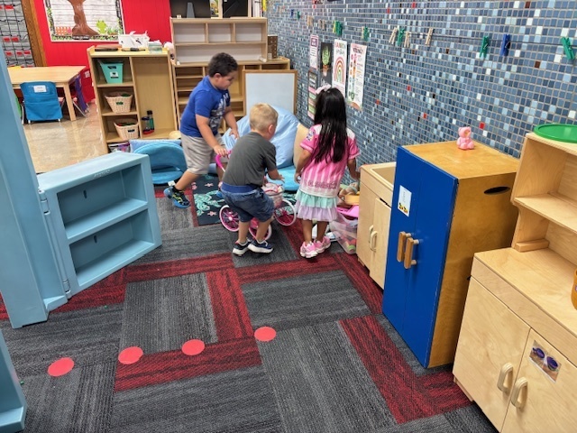 Preschoolers playing in centers
