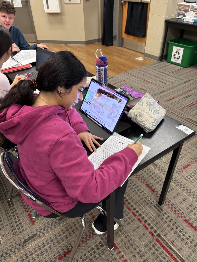 3 pictures of students using anatomage ipads in class.