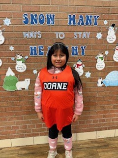A student standing by herself. 