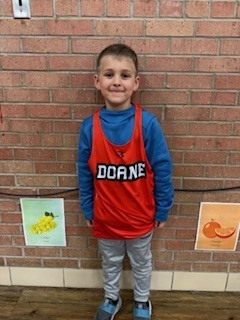 A student standing by himself. 