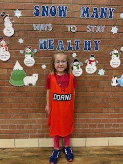 A student standing by herself. 
