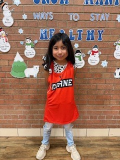 A student standing by herself. 