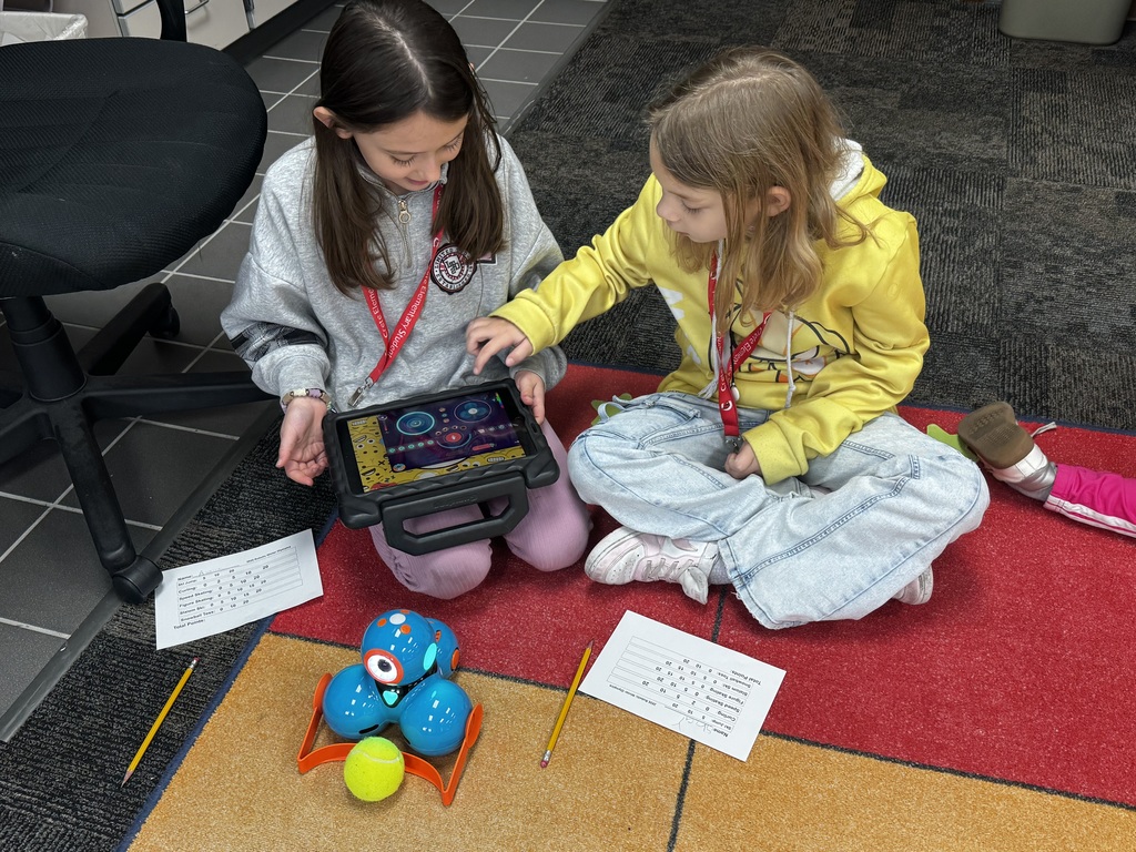 Students working together in computer science class.