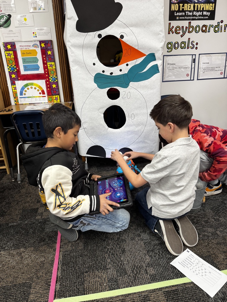 Students working together in computer science class.