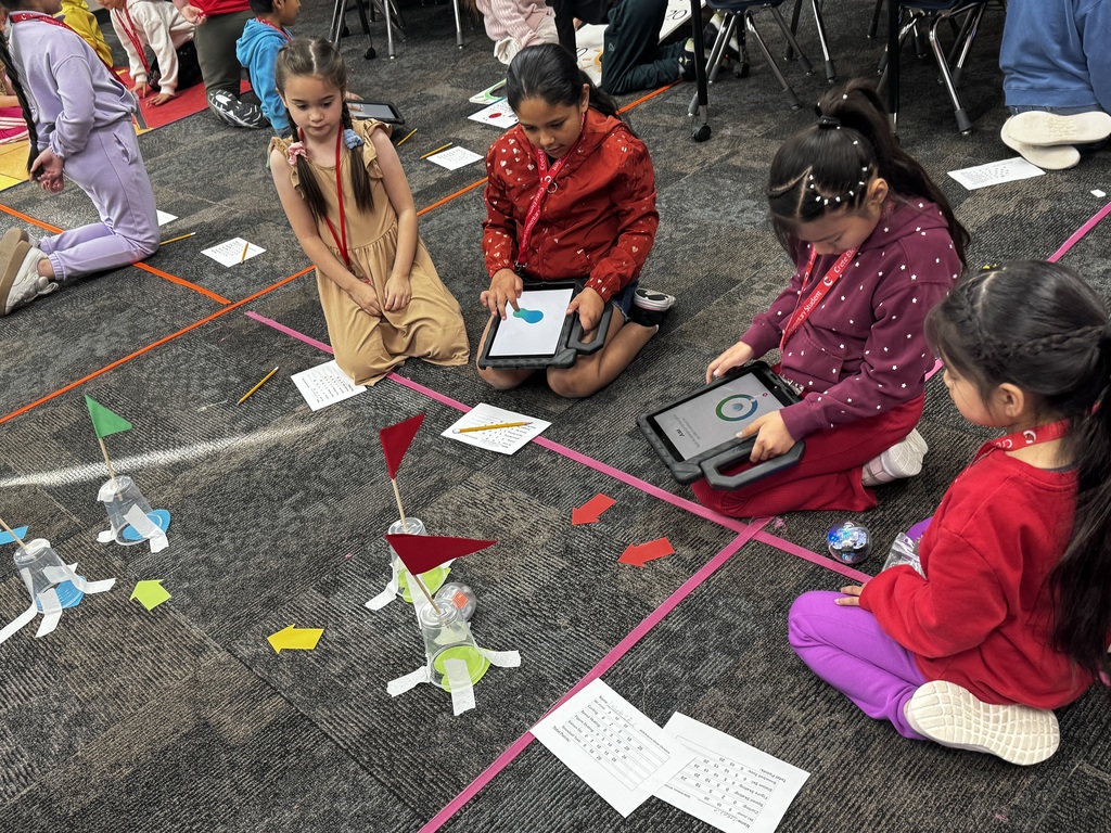 Students working together in computer science class.