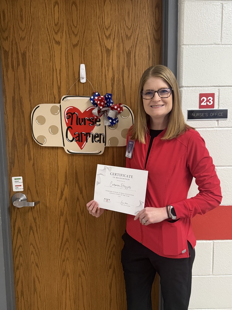 School nurse holding a certificate. 
