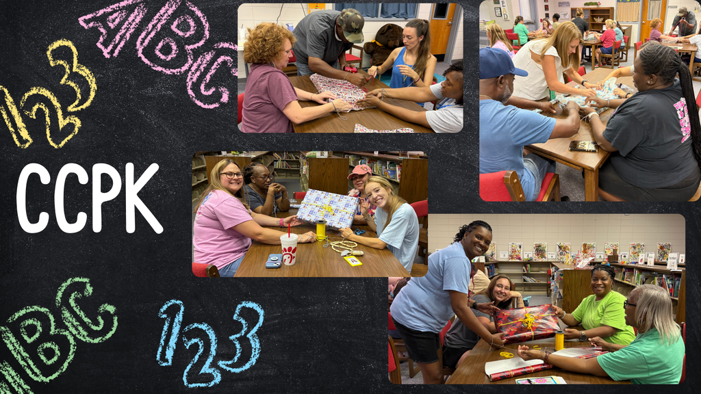 Photo of chalk-style letters and numbers, with CCPK and CCPK faculty working at tables in the media center preparing decorations for the school