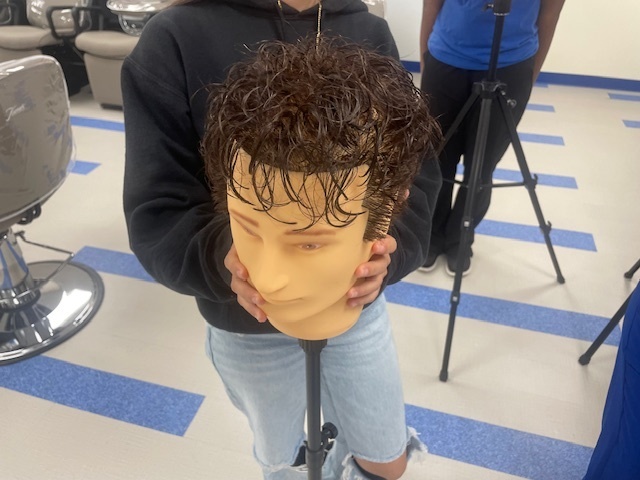 Crockett High School Cosmetology II class showed off their Clipper Haircut techniques.