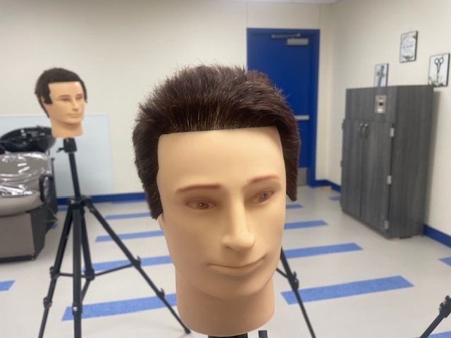 Crockett High School Cosmetology II class showed off their Clipper Haircut techniques.