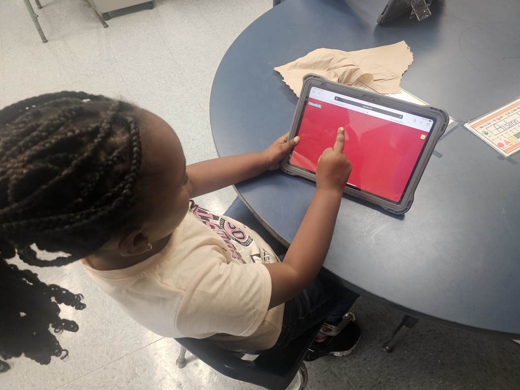 Early Childhood students using new technology equipment