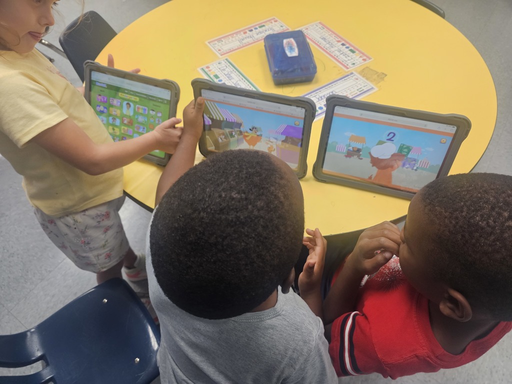 Early Childhood students using new technology equipment