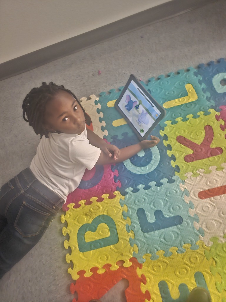 Early Childhood students using new technology equipment