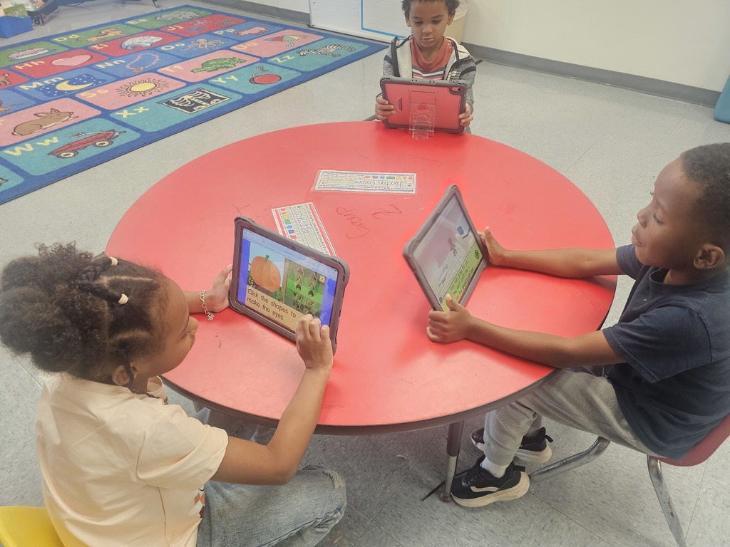 Early Childhood students using new technology equipment