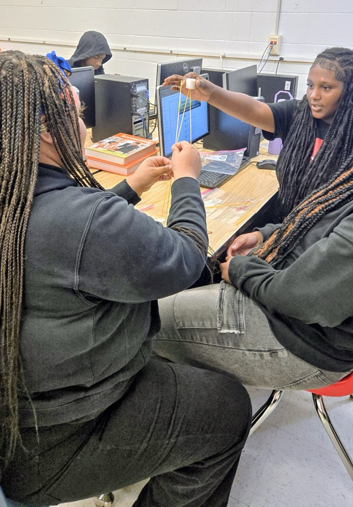 future business students build marshmallow towers