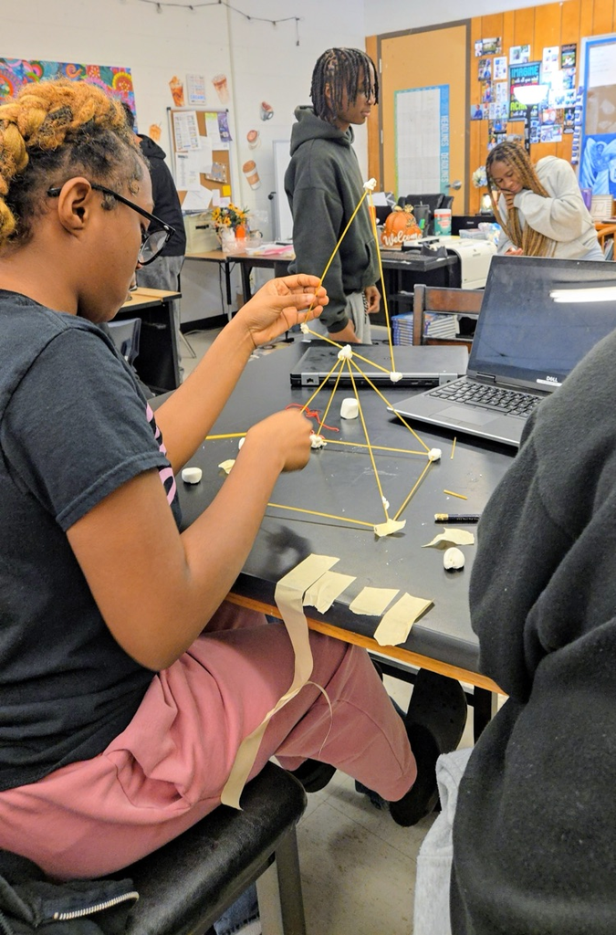 future business students build marshmallow towers